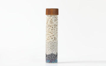 Tofu cat litter in a glass vial — tofu vs crystal cat litter honest comparison for Canadians