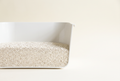 Cassava cat litter filled to proper depth in a litter box